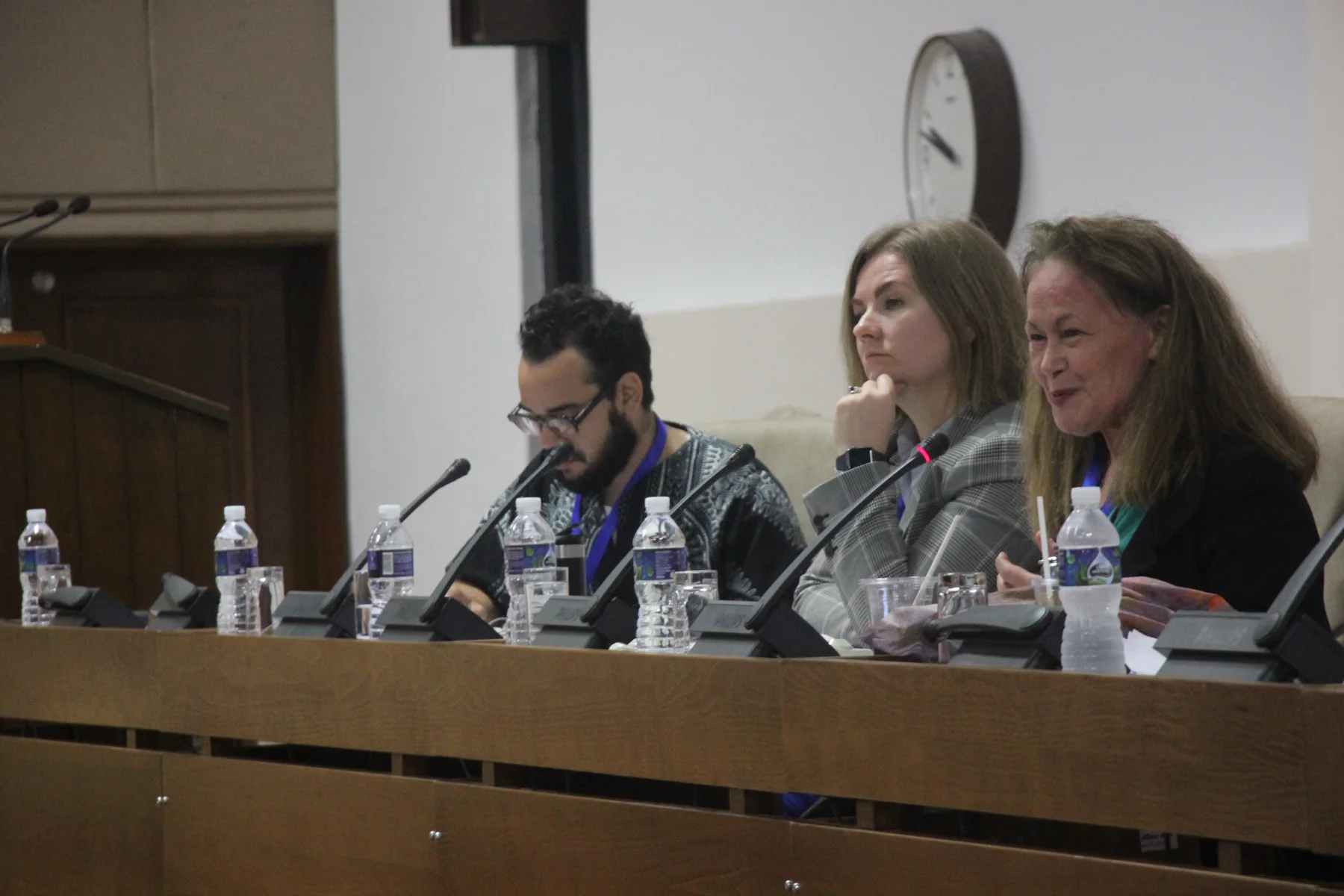 Participants in discussion at a conference table in Havana